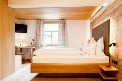 Ein Bett oder Betten in einem Zimmer der Unterkunft Gasthof Adler