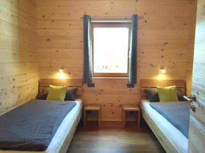 Ein Bett oder Betten in einem Zimmer der Unterkunft Walser Berg Chalets