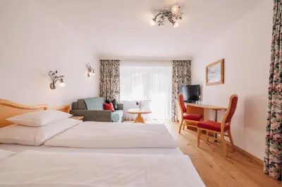 Ein Bett oder Betten in einem Zimmer der Unterkunft Hotel Garni Lavendel