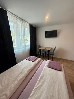 Ein Bett oder Betten in einem Zimmer der Unterkunft Gasthaus Tisis
