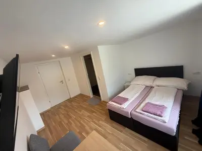Ein Bett oder Betten in einem Zimmer der Unterkunft Gasthaus Tisis