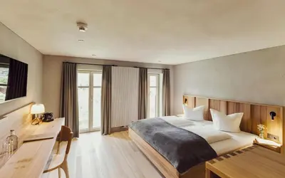 Ein Bett oder Betten in einem Zimmer der Unterkunft Hotel Gasthof Adler