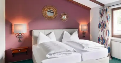 Ein Bett oder Betten in einem Zimmer der Unterkunft Schlosshotel Dörflinger