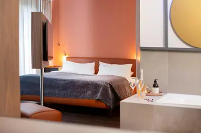 Ein Bett oder Betten in einem Zimmer der Unterkunft hirschen dornbirn - das boutiquestyle hotel - skyrelax & wellness im rooftop