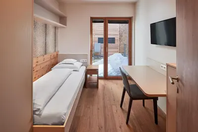Ein Bett oder Betten in einem Zimmer der Unterkunft Hotel Sonnblick