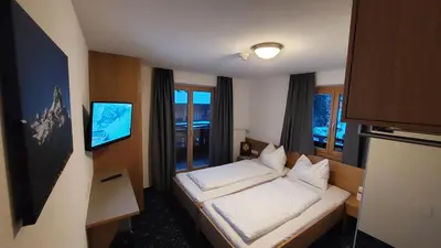 Ein Bett oder Betten in einem Zimmer der Unterkunft Hotel Stülzis