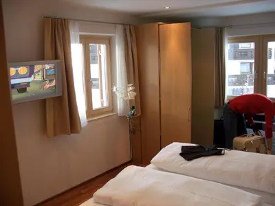Ein Bett oder Betten in einem Zimmer der Unterkunft Hotel Stülzis