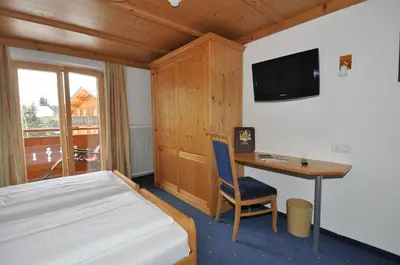 Ein Bett oder Betten in einem Zimmer der Unterkunft Hotel Stülzis