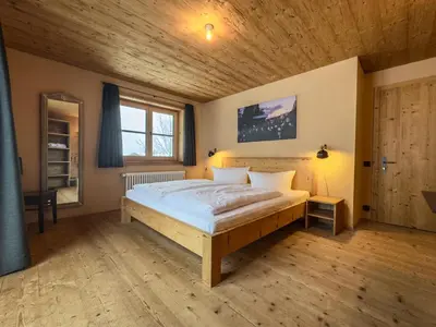 Ein Bett oder Betten in einem Zimmer der Unterkunft alpen select lodge Kleinwalsertal