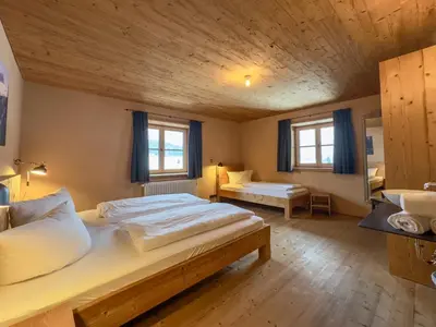 Ein Bett oder Betten in einem Zimmer der Unterkunft alpen select lodge Kleinwalsertal