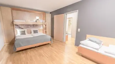 Ein Bett oder Betten in einem Zimmer der Unterkunft JUFA Hotel Montafon