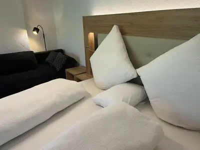 Ein Bett oder Betten in einem Zimmer der Unterkunft Ferienwohnungen Fellhornblick