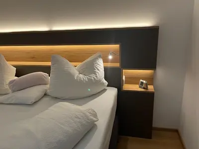 Ein Bett oder Betten in einem Zimmer der Unterkunft Ferienwohnungen Fellhornblick