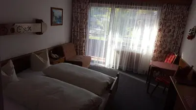 Ein Bett oder Betten in einem Zimmer der Unterkunft Hotel Garni