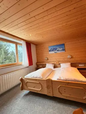 Ein Bett oder Betten in einem Zimmer der Unterkunft Damülser Horn