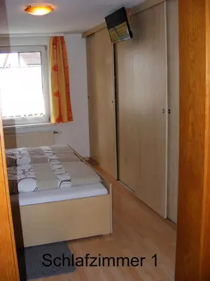 Ein Bett oder Betten in einem Zimmer der Unterkunft Ferienwohnung Huber