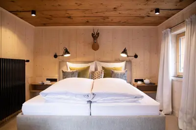 Ein Bett oder Betten in einem Zimmer der Unterkunft Pension Alpenfluh