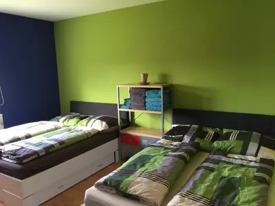 Ein Bett oder Betten in einem Zimmer der Unterkunft Zentral, Geräumig