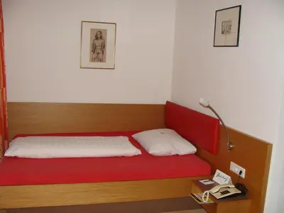 Ein Bett oder Betten in einem Zimmer der Unterkunft Hotel Bischof