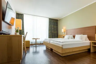 Ein Bett oder Betten in einem Zimmer der Unterkunft Hotel Gasthof Lamm