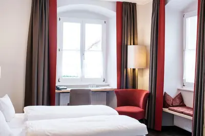 Ein Bett oder Betten in einem Zimmer der Unterkunft Hotel Gasthof Lamm