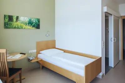 Ein Bett oder Betten in einem Zimmer der Unterkunft Hotel Viktor