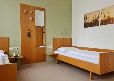 Ein Bett oder Betten in einem Zimmer der Unterkunft Hotel Viktor