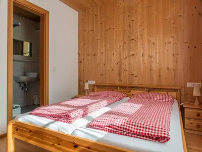 Ein Bett oder Betten in einem Zimmer der Unterkunft Ferienhaus Valleu