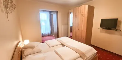 Ein Bett oder Betten in einem Zimmer der Unterkunft Pension Seeblick