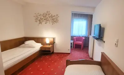 Ein Bett oder Betten in einem Zimmer der Unterkunft Pension Seeblick