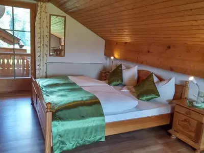 Ein Bett oder Betten in einem Zimmer der Unterkunft Ferienwohnungen Pension Sonnblick