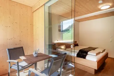 Ein Bett oder Betten in einem Zimmer der Unterkunft Rössle Appartements und Sport Rössle Skiverleih & Sportgeschäft