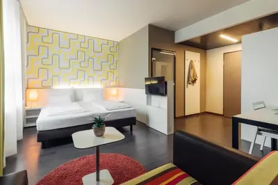 Ein Bett oder Betten in einem Zimmer der Unterkunft harry's home Dornbirn hotel & apartments