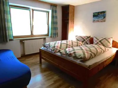 Ein Bett oder Betten in einem Zimmer der Unterkunft Haus Mittagspitze