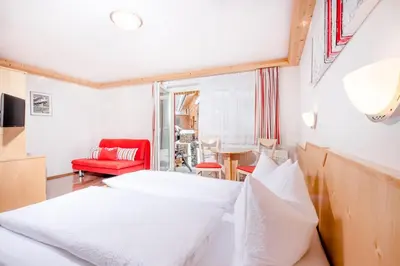 Ein Bett oder Betten in einem Zimmer der Unterkunft Hotel Garni Krumbach