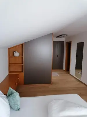 Ein Bett oder Betten in einem Zimmer der Unterkunft Hotel Garni Tannleger B&B