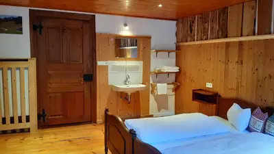 Ein Bett oder Betten in einem Zimmer der Unterkunft Landhaus Bad Hopfreben