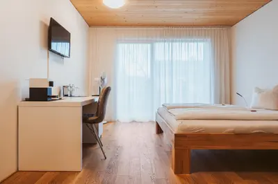 Ein Bett oder Betten in einem Zimmer der Unterkunft Gästehaus Gritsch