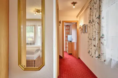 Ein Bett oder Betten in einem Zimmer der Unterkunft Hotel Garni Sursilva