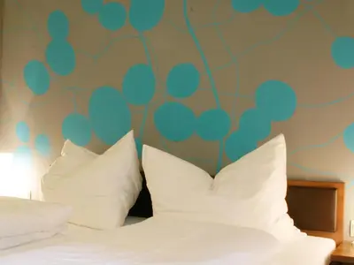 Ein Bett oder Betten in einem Zimmer der Unterkunft Brauereigasthof Reiner