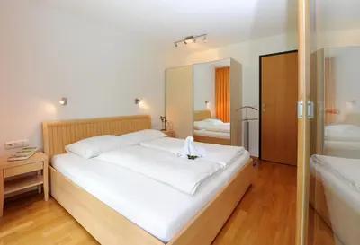 Ein Bett oder Betten in einem Zimmer der Unterkunft Apartments Susanne