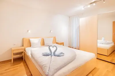 Ein Bett oder Betten in einem Zimmer der Unterkunft Apartments Susanne