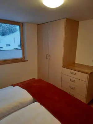 Ein Bett oder Betten in einem Zimmer der Unterkunft Ferienwohnung Schrofamühli