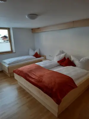 Ein Bett oder Betten in einem Zimmer der Unterkunft Ferienwohnung Schrofamühli