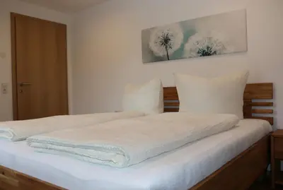 Ein Bett oder Betten in einem Zimmer der Unterkunft Ferienwohnung Därflihof