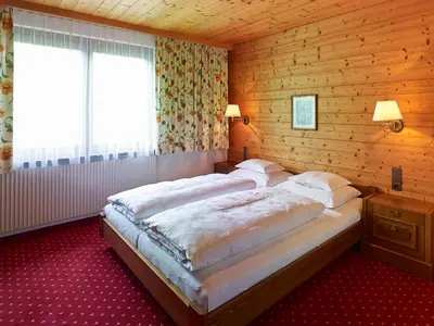 Ein Bett oder Betten in einem Zimmer der Unterkunft Chalet Rüfikopf