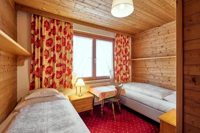 Ein Bett oder Betten in einem Zimmer der Unterkunft Chalet Rüfikopf