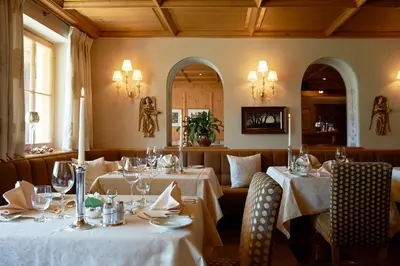 Ein Restaurant oder anderes Speiselokal in der Unterkunft Alpenland - das feine Kleine, zentral und ruhig mit modernem Wellnessbereich