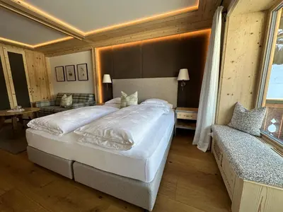 Ein Bett oder Betten in einem Zimmer der Unterkunft Alpenland - das feine Kleine, zentral und ruhig mit modernem Wellnessbereich