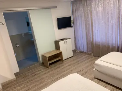 Ein Bett oder Betten in einem Zimmer der Unterkunft Smart Stay Rooms Feldkirch
